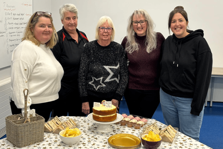 Pam, centre, has retired from teaching swimming after more than 60 years.