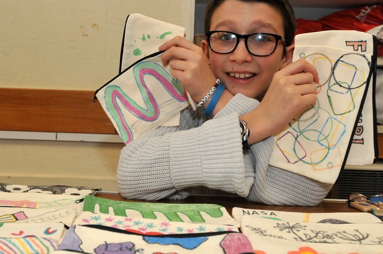 Newton Abbot Youth Council Art and Craft Fayre at the Courtenay Centre. Youth council members Ethan Perez Mills (11) and bespoke designed pencil cases