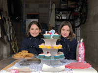 Sisters' garage cake sale for Rowcroft 