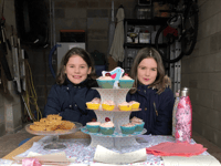 Sisters' garage cake sale for Rowcroft 