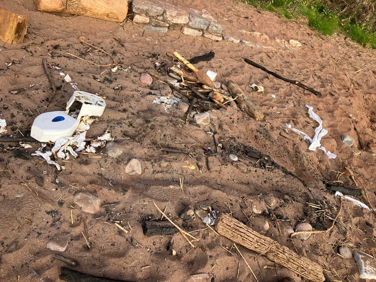 A toilet roll dispenser and loo roll from a public toilet has been dumped at Coryton. Photo Eyes of Dawlish