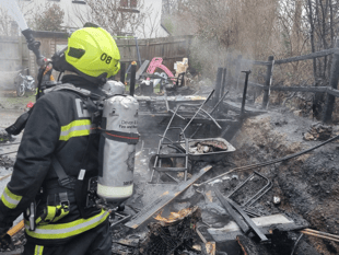 Garden ravaged by fire as crews save house 