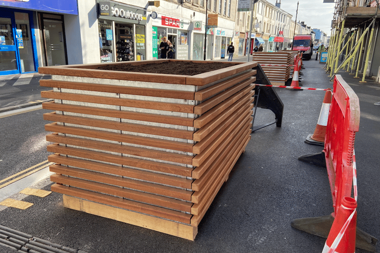 The planters that will contain Juneberry trees have been put in place along Queen Street 