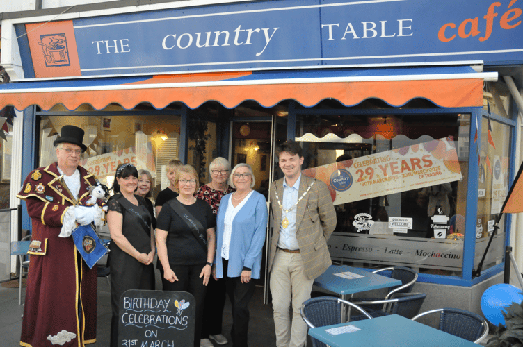 Mayor of Newton Abbot, Cllr Alex Hall, right, said a few words at Country Table's 29th anniversary today, March 31