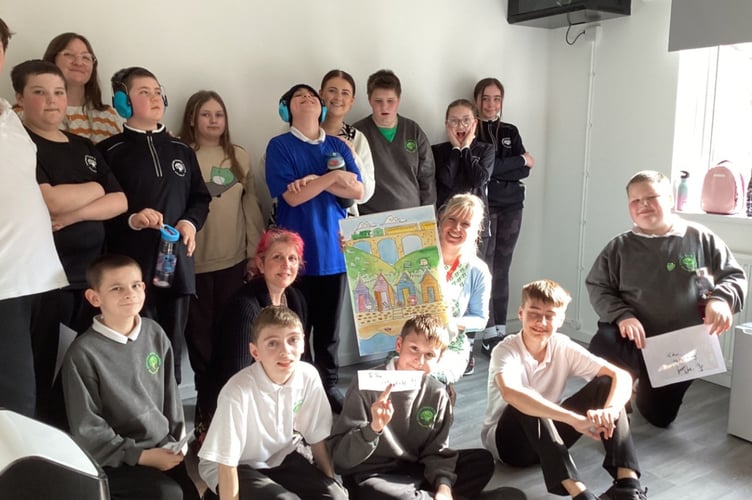 Artist Laura Wall with students at Orchard Manor School. 