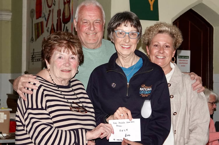Donation from the Over 60s disco to the RNLI, left to right Carol Tamlyn, DJ Steve Jessup, RNLI's Wendy Richard and Linda Marsh. photo Bob Simpson 