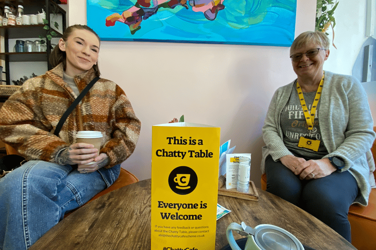 Volunteer Cathy Pennicott, right, will be on hand at the Chatty table even Monday between 10.30am and 12pm