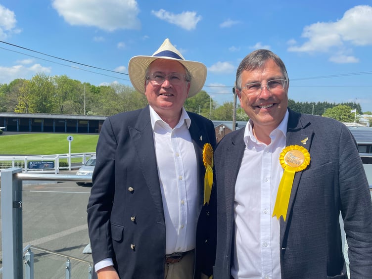 Martin Wrigley MP (r) celebrating David Cox's Liberal Democrat win in Teignmouth at Newton Abbot Racecourse today.