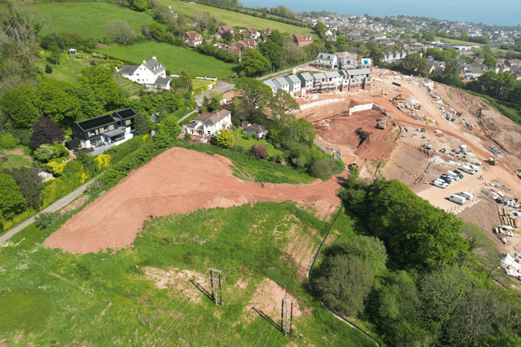 Harrington Homes' site to the right, with the adjacent, north-west field being used to store soil to the left. The unauthorised dumping has prompted TDC to issue a stop notice against the developer 