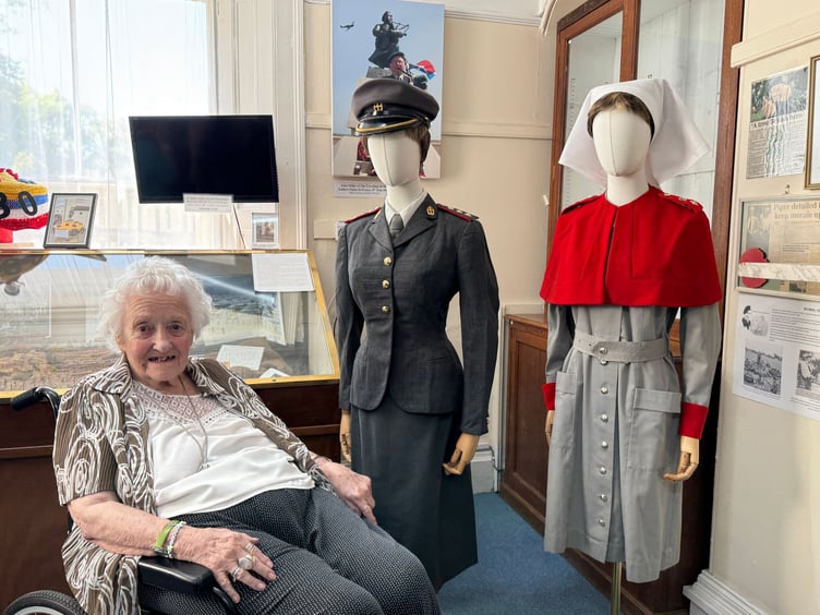 June Sutton with her Army nursing uniform now on display at Dawlish Museum. Photo BOB SIMPSON