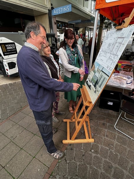 David and Jane Clarkson with Dr Dixon and the What’s in Store? display