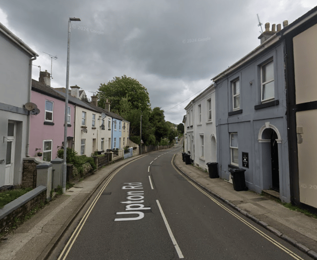Man charged after body found in flat
