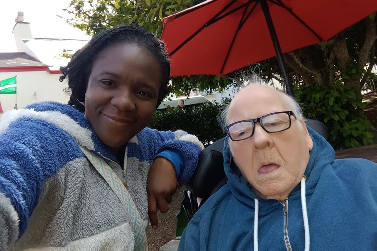 Martin Graham with carer Modupe Oluwatayo in Dawlish.