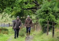 Prince William visits Princetown amid biblical rain