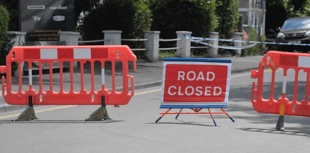 Road closed as one taken to hospital after motorbike collision 