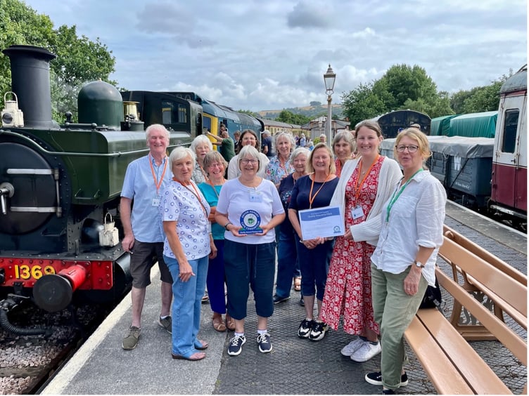Volunteers celebrate Buckfastleigh Memory Cafe achieving the Quality Mark at South Devon Railway.