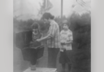 Help identify people in photo taken from camera bought from Devon antique shop