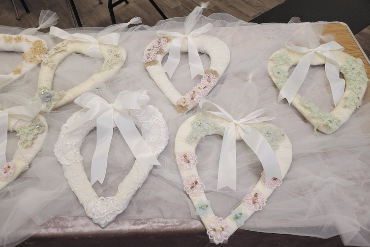 The group spent an evening of late creating heart-shaped ornaments from pre-loved weddings dresses.