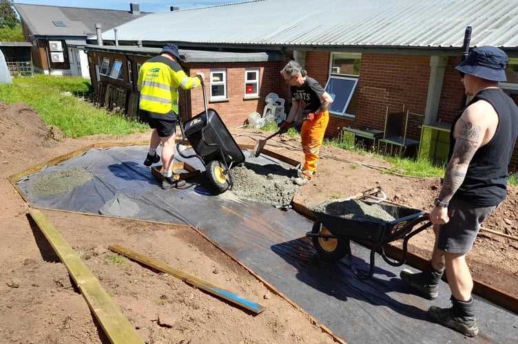 Westbank Community Allotment - three volunteers from Kier laying the new pathway (photo supplied by Kier)
