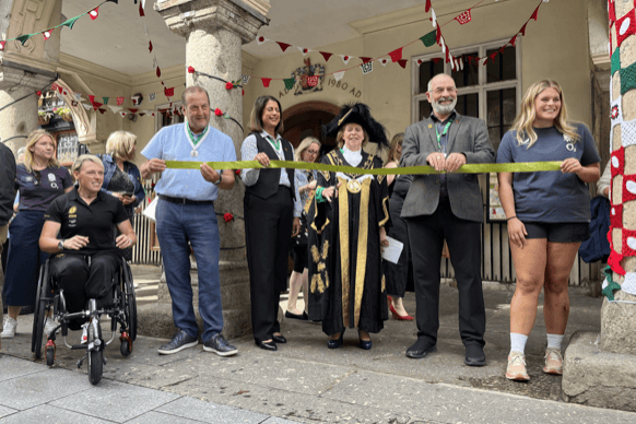 Lord Mayor of Exeter Cllr Anne Jobson cuts the tape to launch the World Cup yarn art initiative