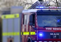 Firefighters battle caravan fire