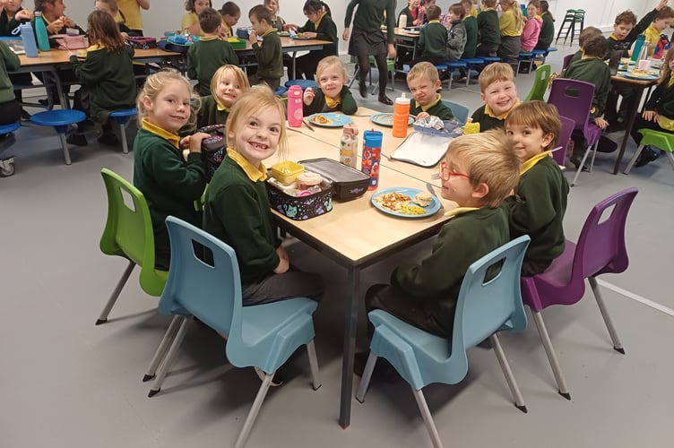 Happy pupils in their new hall at Kenton Primary School
