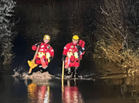 Fire crew's safety plea as two rescued from car stuck in flood water