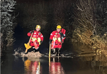Fire crew's safety plea as two rescued from car stuck in flood water
