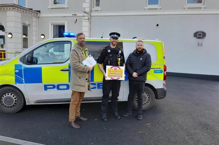 PC George Miller, Dawlish Neighbourhood Beat Manager, with staff at Oakwood College. Photo Oakwood College 