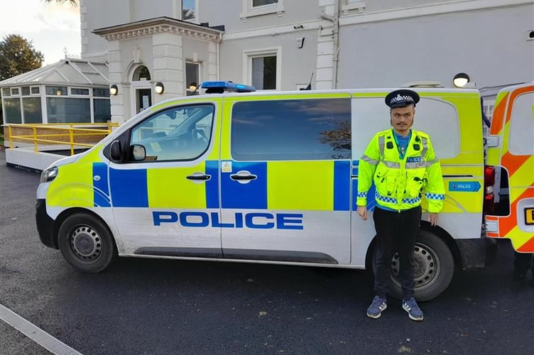 An Oakwood College student experiences a police uniform. Photo Oakwood College 