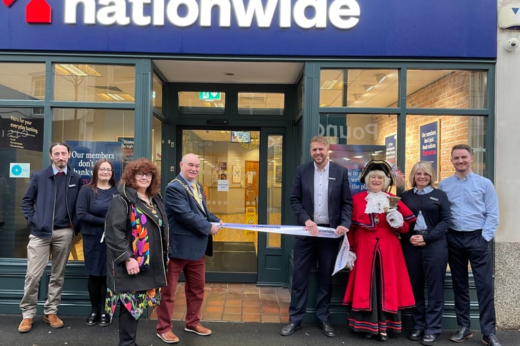 L-R Nationwide colleagues Sean Nicholson and Vikki Brimicombe, Newton Abbot lady mayoress June Parker, Newton Abbot mayor councillor Colin Parker, Nationwide manager Micheal Roberts, Kingsteignton town cryer Jackie Edwards, Nationwide manager Amanda Duncan and Nationwide colleague James Roberts 