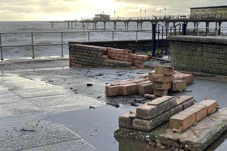 Storm Ingrid hit Teignmouth seafront hard. The end of the pier was washed away and waves battered walls and paving.