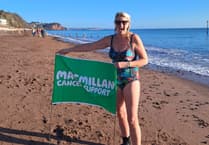 Brave swimmer takes on freezing challenge for charity
