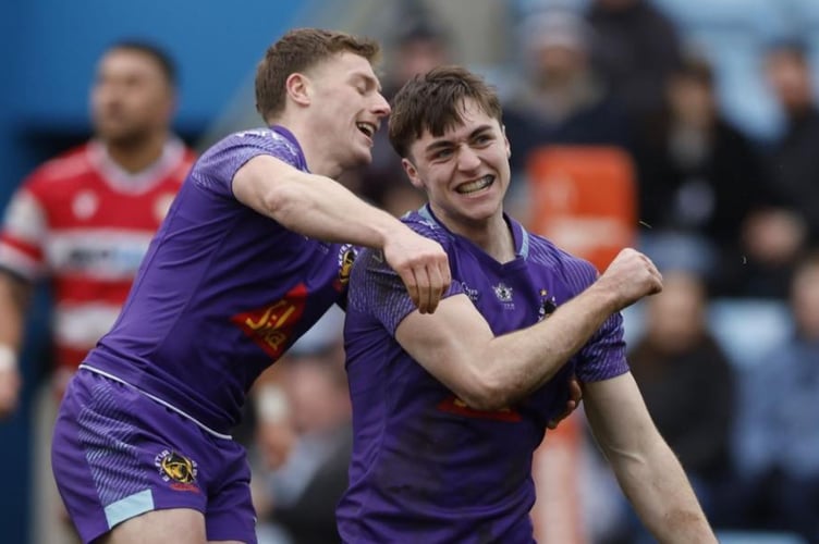 Exeter's Tom Cairns is the first to congratulate fellow Chief Campbell Ridl on sealing his latest hat-trick of tries (Picture: Exeter Chiefs)