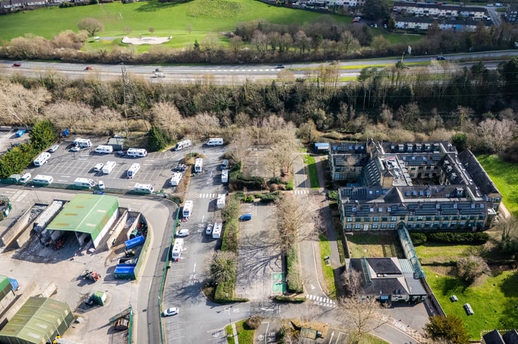 Teignbridge District Council's HQ carpark, Newton Abbot, Devon, where travellers have set up camp.  March 2, 2026. //  Dozens of travellers have set up an unauthorised encampment - in a council's car park.  Teignbridge District Council said: "Due to an unauthorised encampment of caravans and other vehicles in Forde House car park, which arrived on Saturday, parking at the site will be severely limited this week.  "Our reception will be open as usual for anyone who has an appointment with one of our services. 