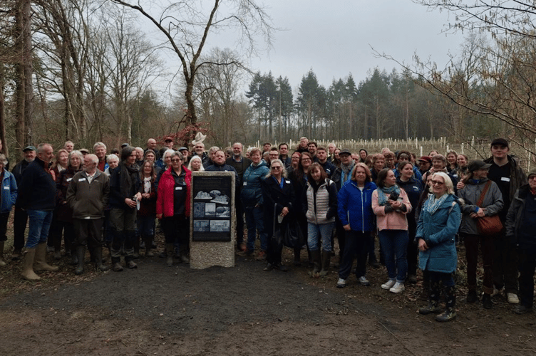 Guests unveil a plinth to commorate the end of the restoration project at Stover Country Park