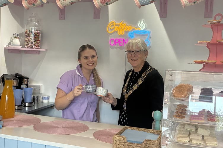 Mayor of Bovey Tracey Cllr Sheila Brooke enjoys a cuppa at the opening of the new ice cream bar at Mulberry House Care Home. photo contributed 