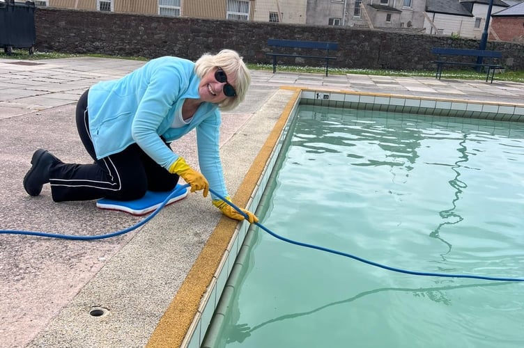 Teignmouth Lido volunteer Catherine helping get the pool ready. Photo Teignbridge Leisure