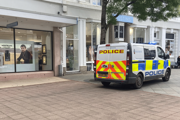 A man and woman were detained and searched by police outside Austins department store on Thursday afternoon (April 30)