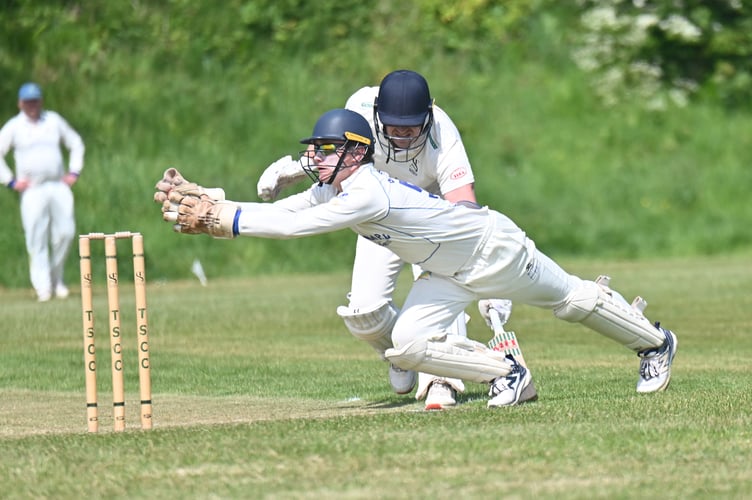 Devon Cricket League C Division East. Teignmouth and Shaldon 1st XI versus Sandford 2nd XI. Sanford 'keeper Elliott Butterfield dives for the wicket but T&S batsman Alastair Cliffe is aross the crease