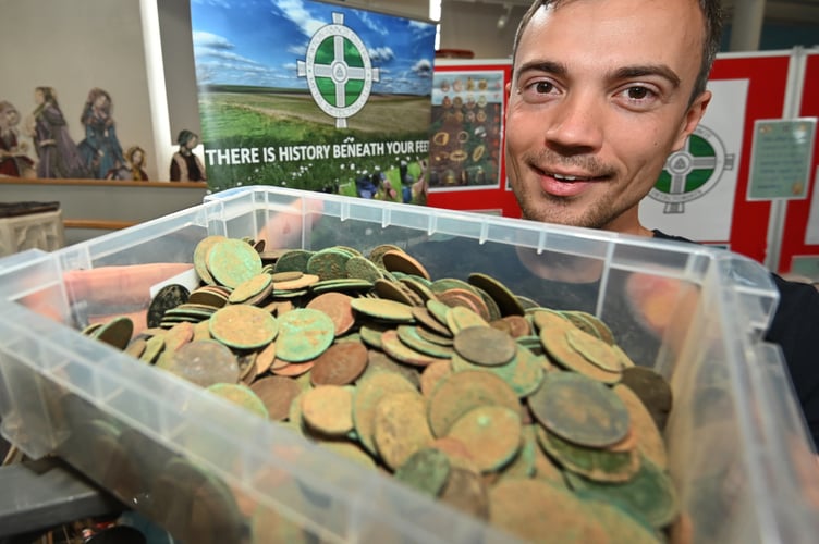 Teignbridge Archaeological Society archaeology fair at Newton Abbot Town Hall. Laurie Allnatt from Newton Abbot Metal Detectorists and a selection of coins 