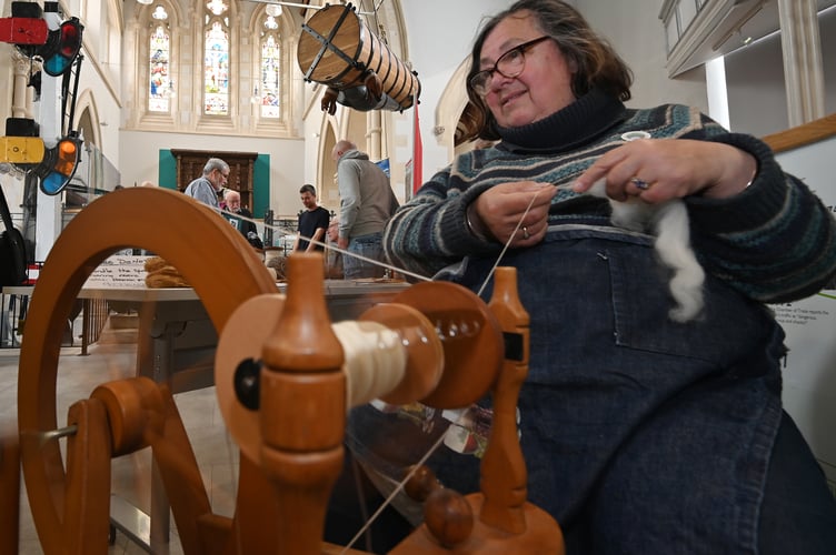 Teignbridge Archaeological Society archaeology fair at Newton Abbot Town Hall. Philippa Simmons demonstrating spinning