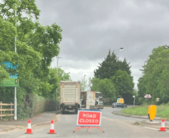 Road closed after two-vehicle collision as air ambulance spotted