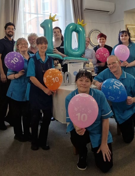 Staff at St Benet's Court care home celebrate top marks. Photo contributed