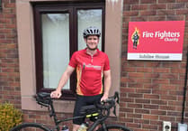 Firefighter surpasses charity target on first day