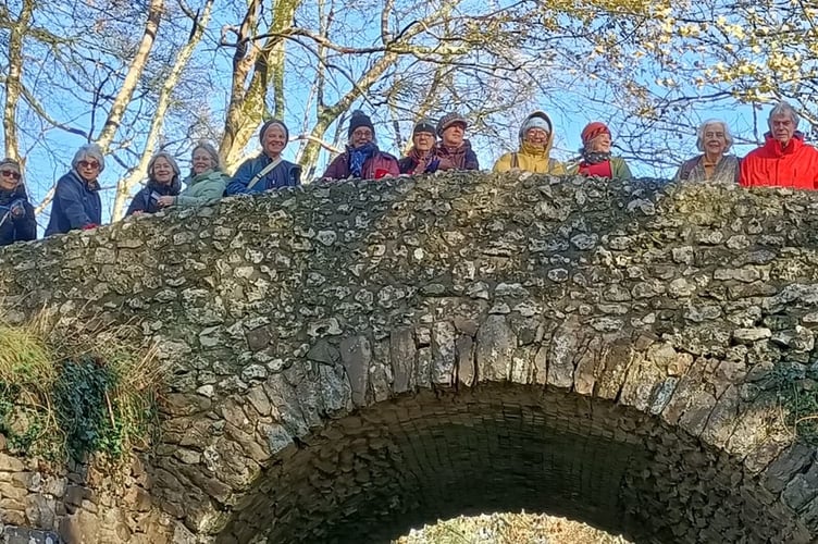 Teign Contemporary collective of artists and writers on a stone bridge