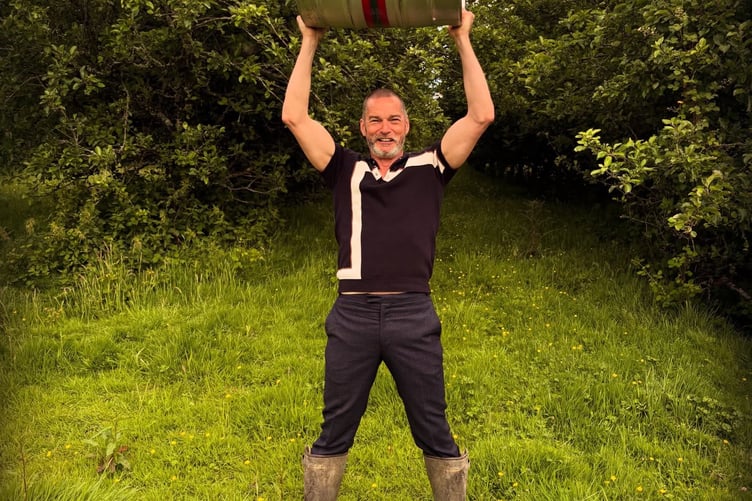 Fred Sirieix weighlifting a keg. Photo Fred Sirieix on Facebook
