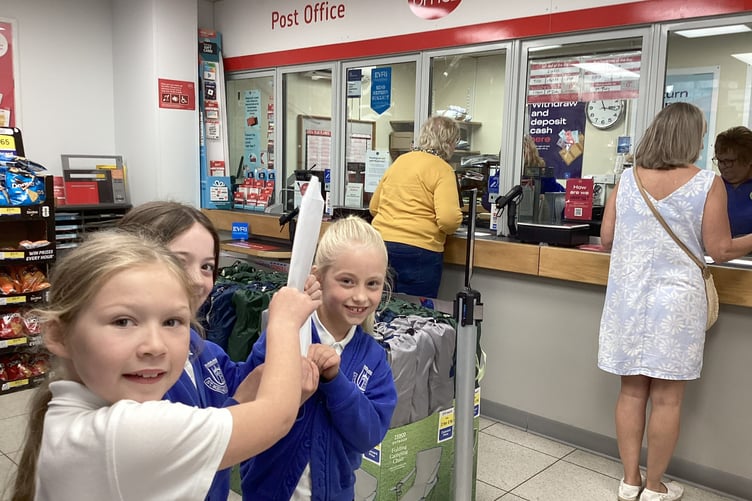 Children from St Michael's Primary School in Kingsteignton post their letters, which have to be signed for on delivery. Photo supplied