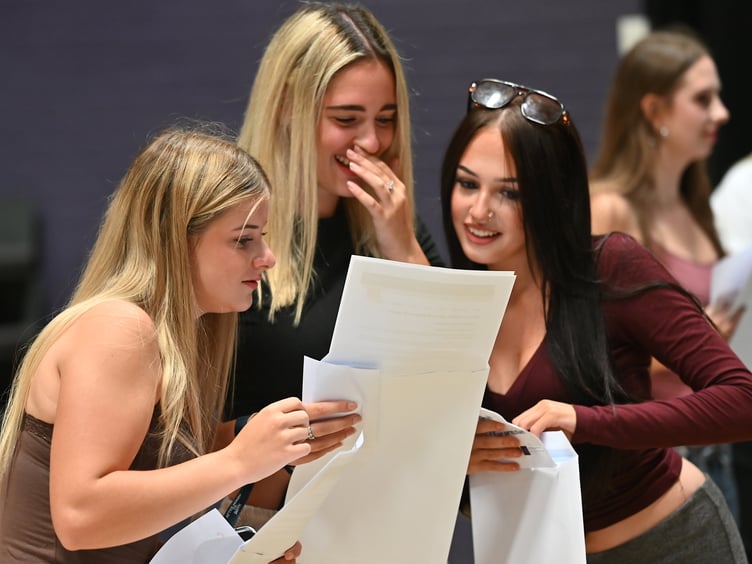 GCSE results day at Teign School in Kingsteignton. Moment of truth time for Hannah Tapp, Scarlett Cresswell and Lola Avery. The three will be heading to Exeter College in the autumn to continue their studies
