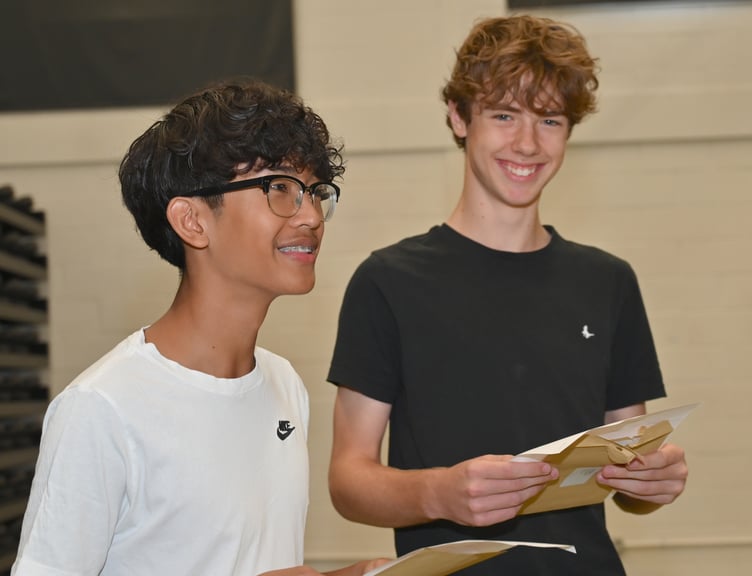GCSE results day at Newton Abbot College. Ron Lazaro and Ewan Blaney open their all-important envelopes